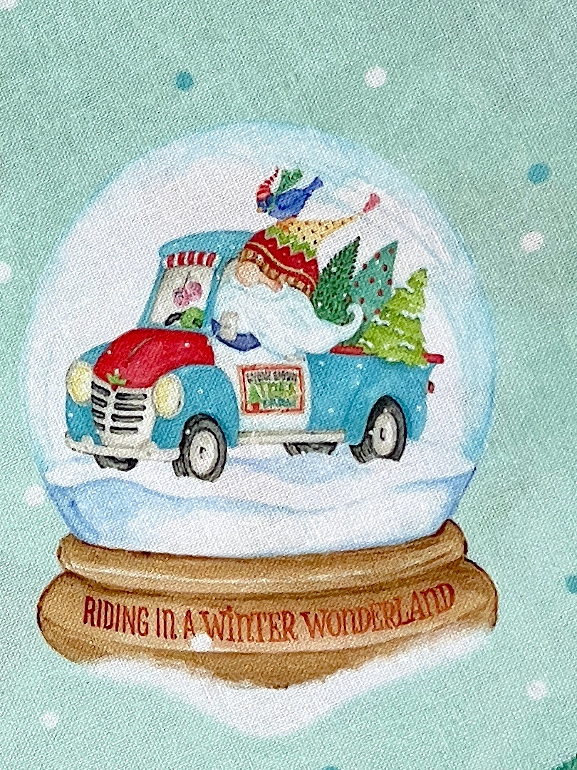 Close up of a gnome inside a gnome driving a truck that is filled with trees.