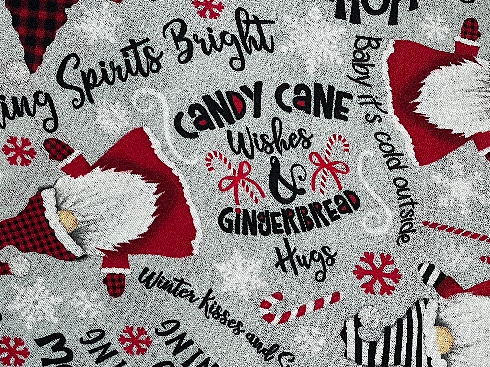 Close up of candy cane wishes and gingerbread hugs and candy canes.