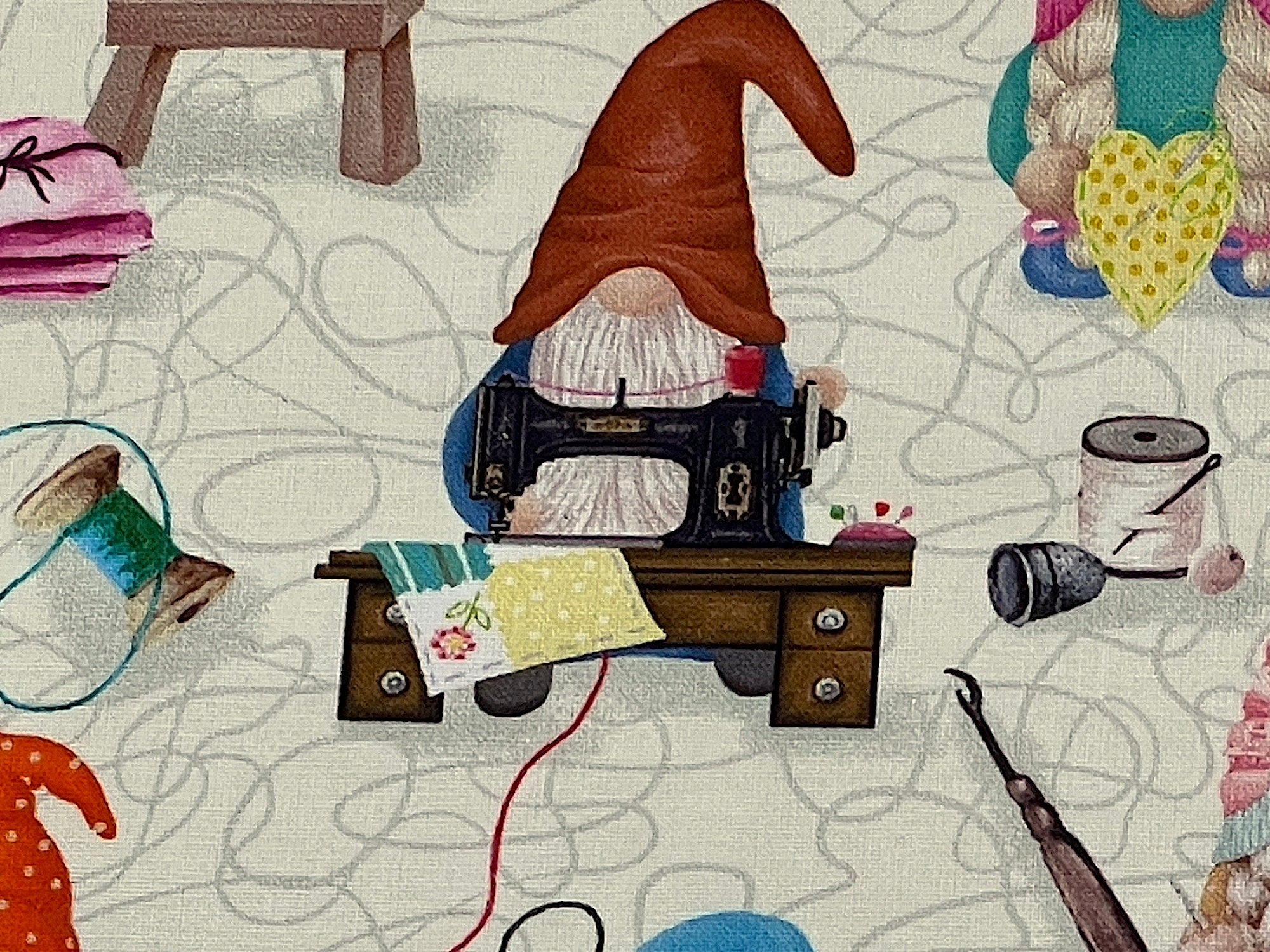 Close up of a gnome at a sewing machine.