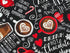 View of the top of 2 hot cocoa cups with hearts inside the cups.
