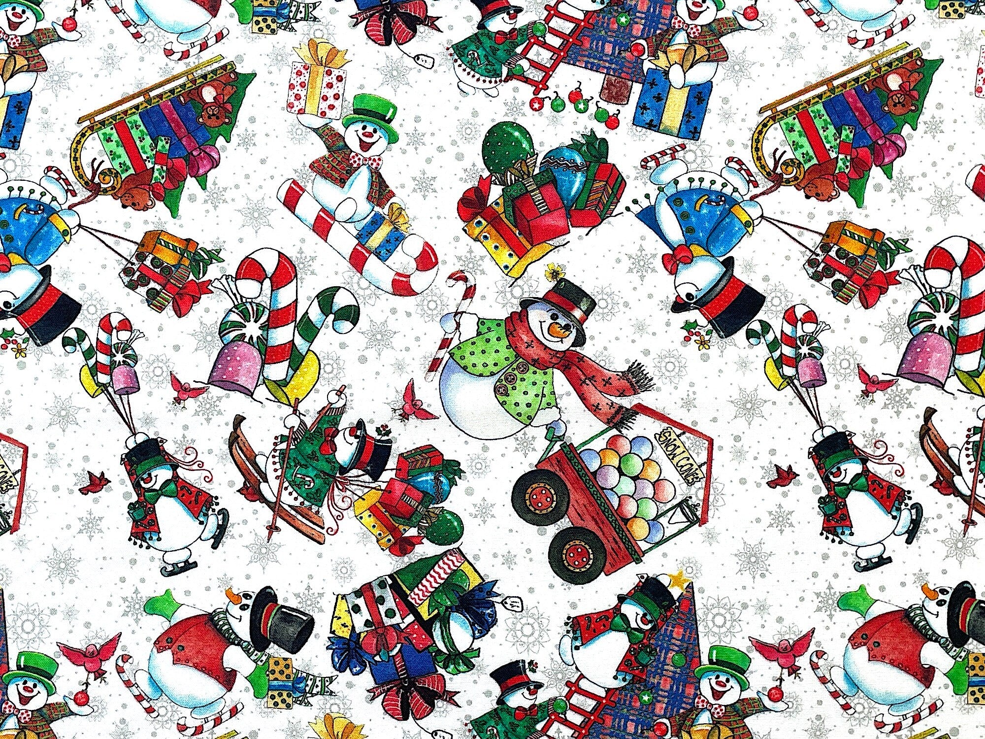 Close up of snowmen, trees, presents, candy canes, snowflakes and more.