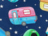 Close up of a pink and blue travel trailer that is surrounded by white stars.