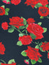 Close up of red roses on a black background.