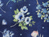 This fabric is part of the Indigo Petals collection by Beth Grove. This blue fabric is covered with blue and pink flowers, green leaves and blue butterflies.
